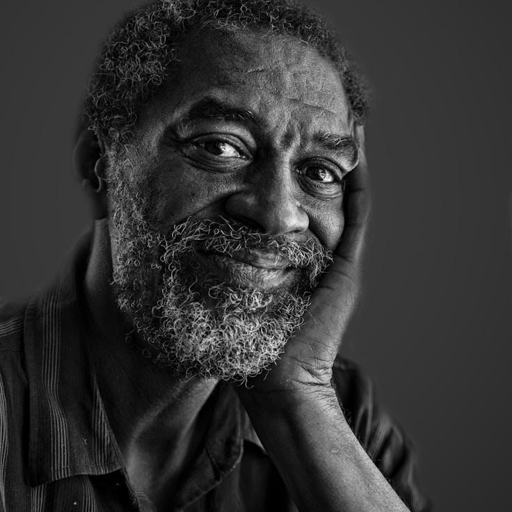 Maya Chen, Lead Design Curator at Ample Meadow Hub, reviewing corporate floral arrangements